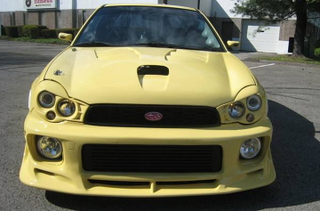Illustration for article titled For $12,900, Does This Wild 2002 Subaru Impreza WRX Work It?